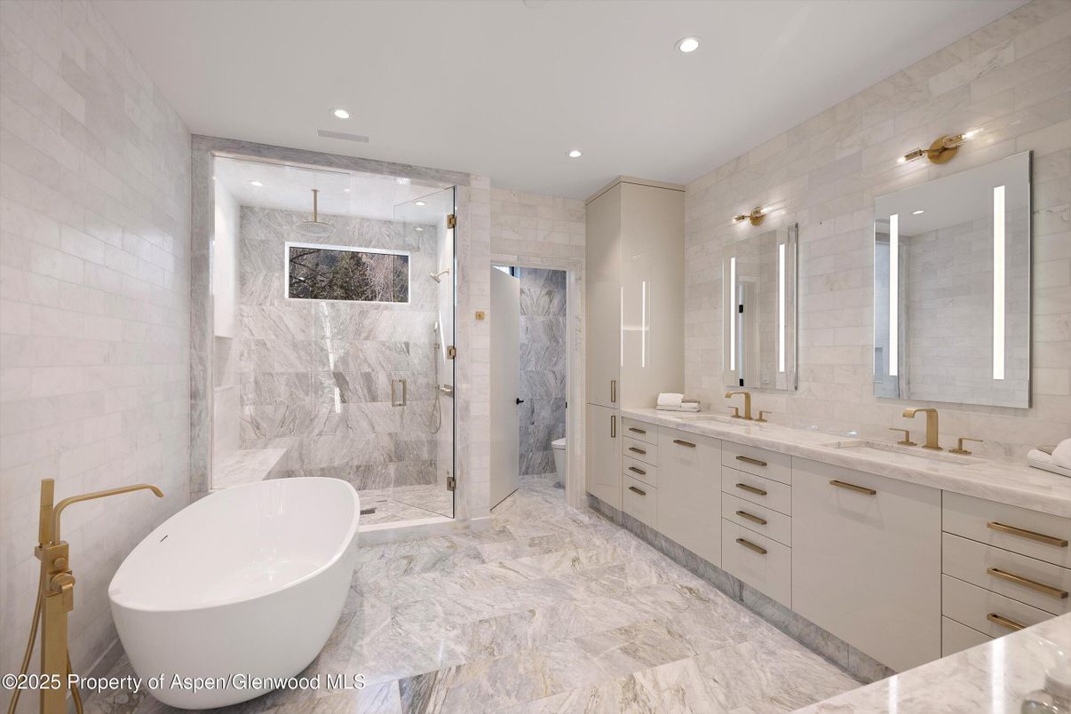 Bathroom, Dual Sink Vanities, Free Standing Baths, Glass Shower, Interior, Marble, Marble Walls, Recessed Lighting