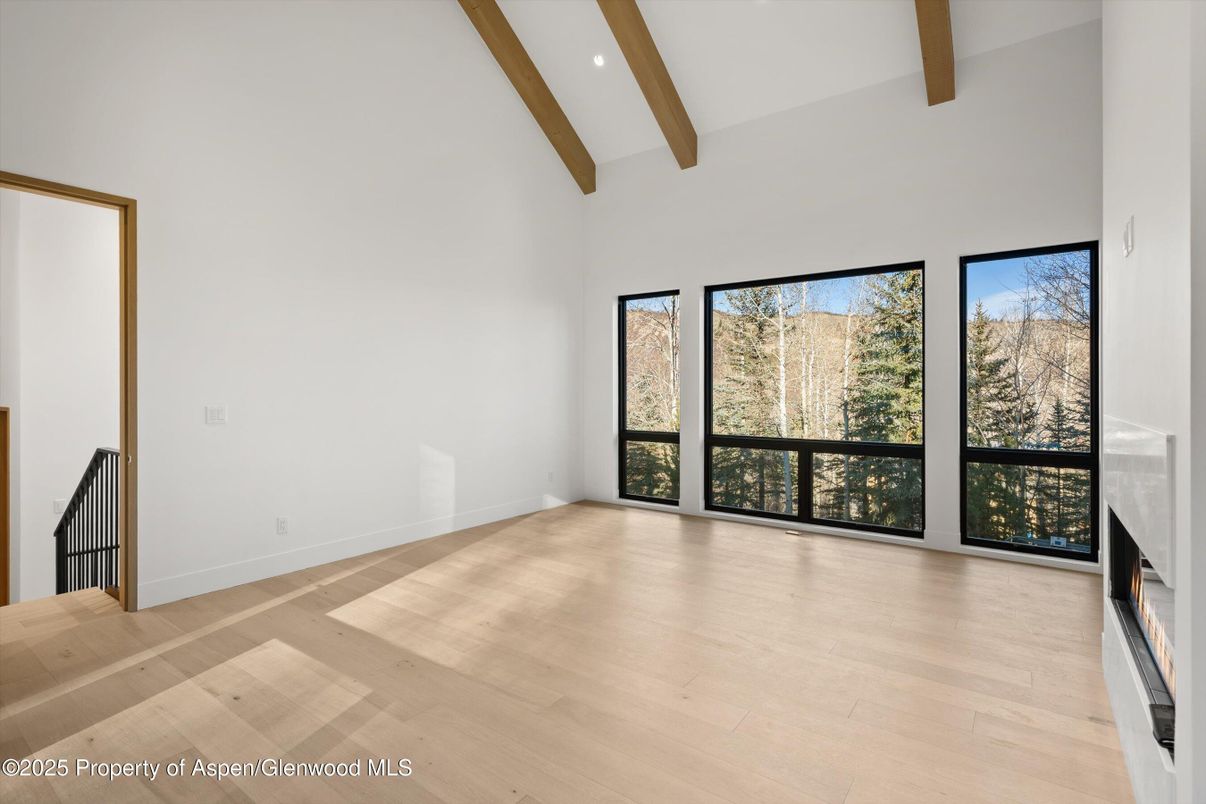 Empty room, Fireplace, Interior, Recessed Lighting, Wooden Beams, Wood Texture Flooring