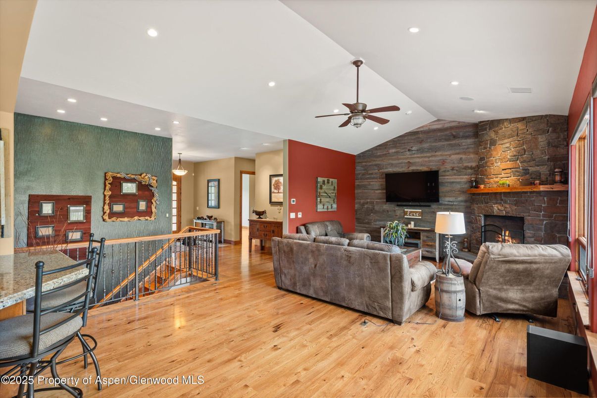 Fireplace, Interior, Living room, Pendant Lights, Recessed Lighting, Stone Walls, Wood Texture Flooring