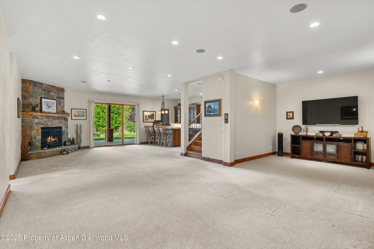 Chandelier, Dining room, Empty room, Fireplace, Interior, Recessed Lighting, Stone Walls