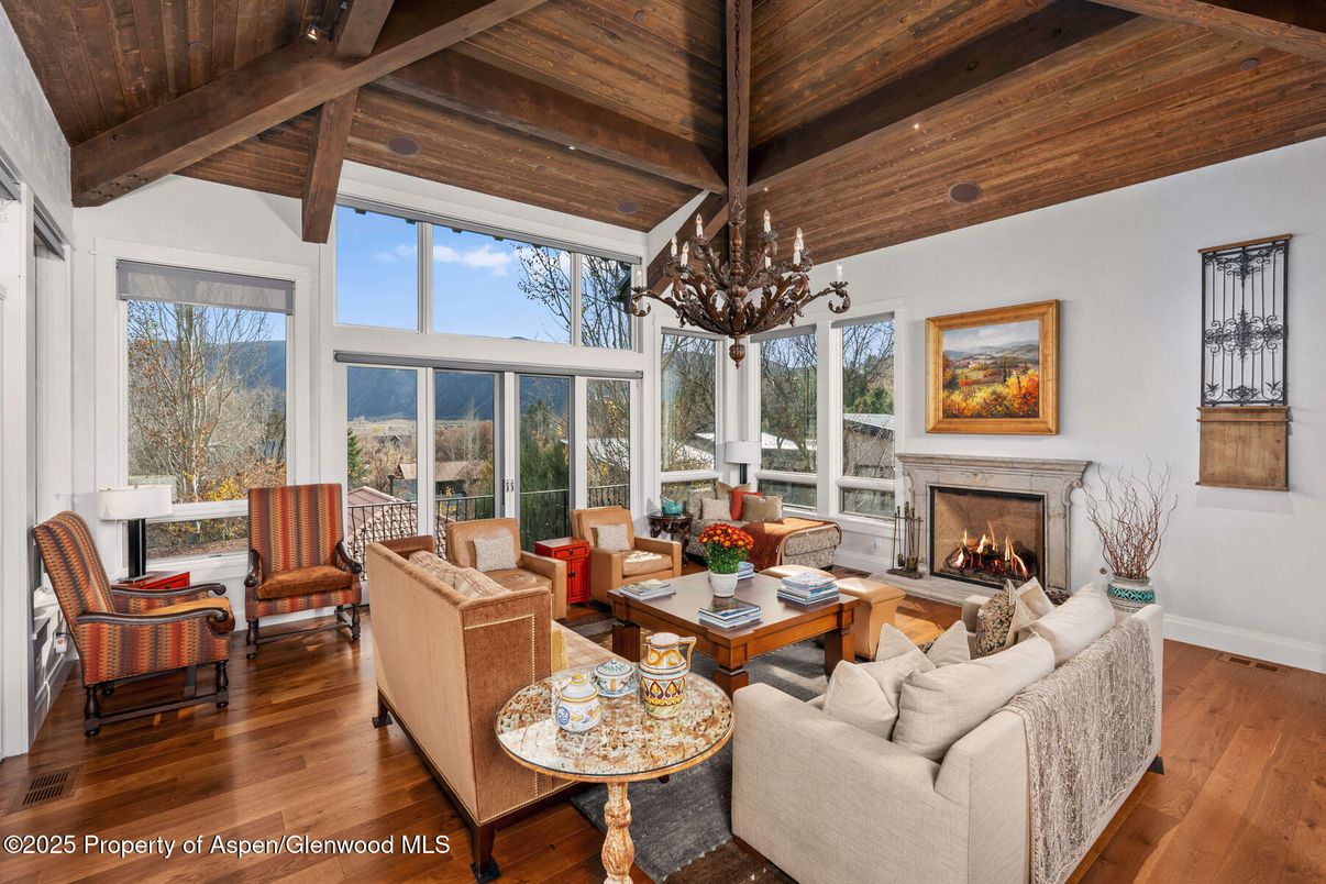 Chandelier, Fireplace, Interior, Living room, Recessed Lighting, Wooden Beams, Wooden Ceilings, Wood Texture Flooring