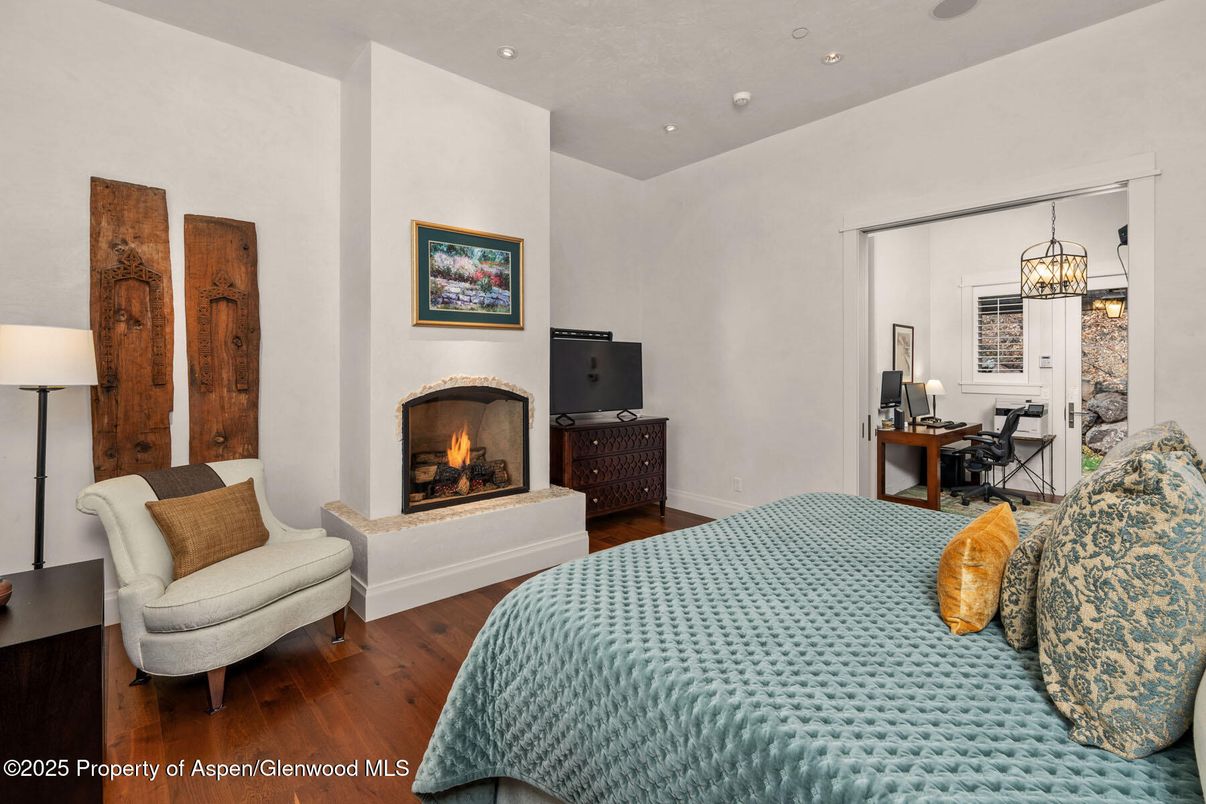 Bedroom, Fireplace, Interior, Pendant Lights, Recessed Lighting, Wood Texture Flooring