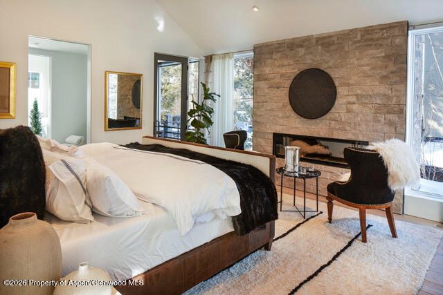 Bedroom, Fireplace, Interior, Recessed Lighting, Stone Walls, Wood Texture Flooring