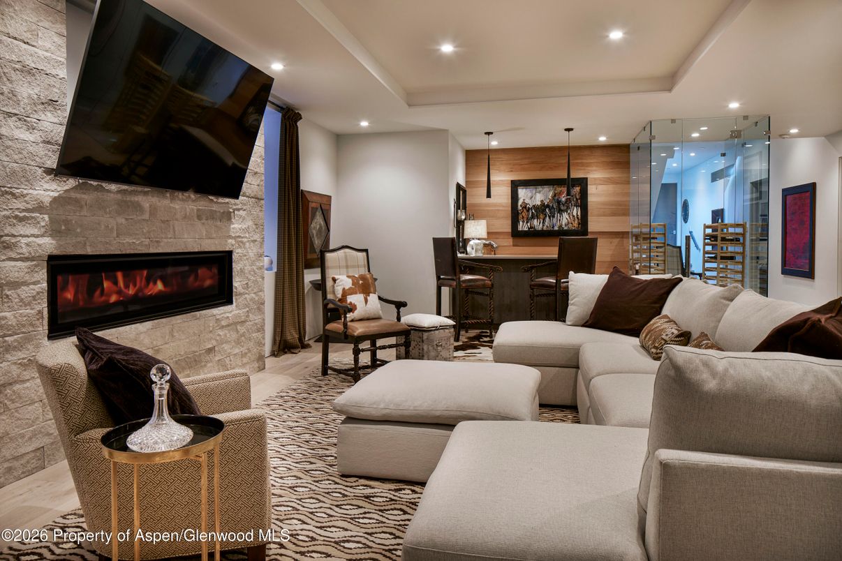 Dining room, Fireplace, Interior, Living room, Recessed Lighting, Stone Walls, Wooden Walls