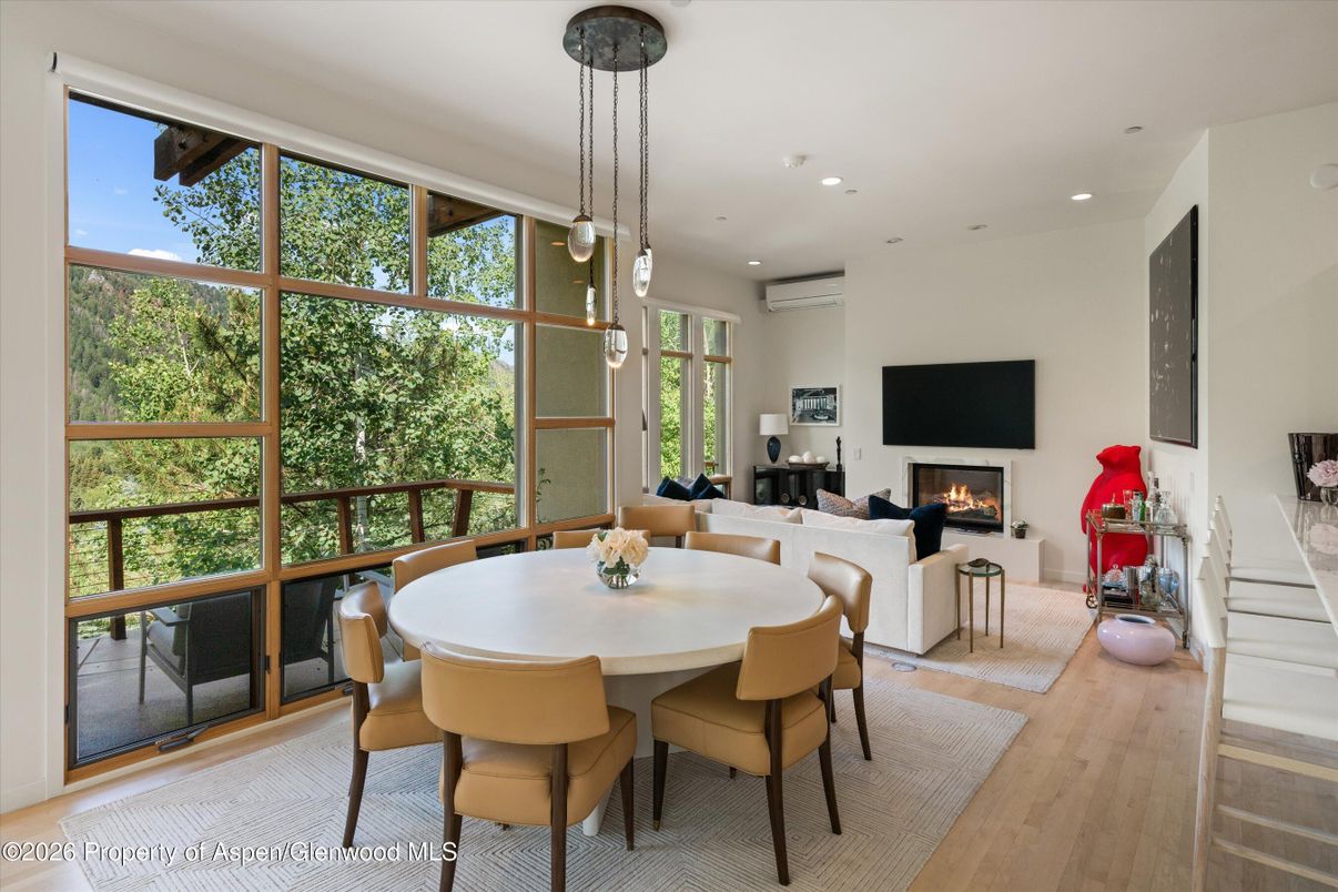 Dining room, Fireplace, Interior, Living room, Pendant Lights, Recessed Lighting, Wood Texture Flooring