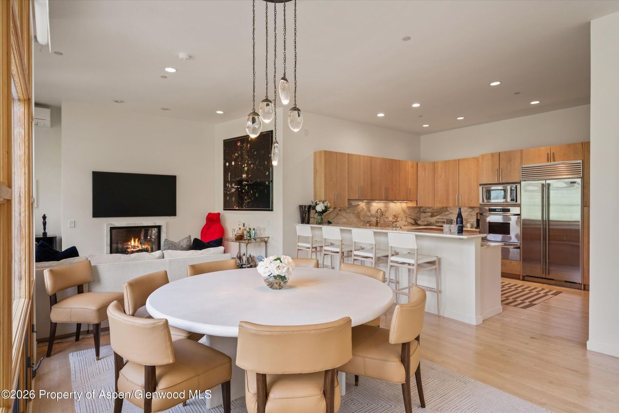 Dining room, Fireplace, Interior, Kitchen, Living room, Pendant Lights, Recessed Lighting, Stainless Steel Appliances, Wood Texture Flooring