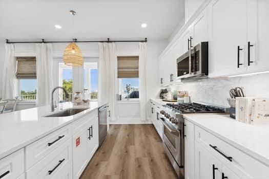 Interior, Kitchen, Pendant Lights, Recessed Lighting, Stainless Steel Appliances, Wood Texture Flooring
