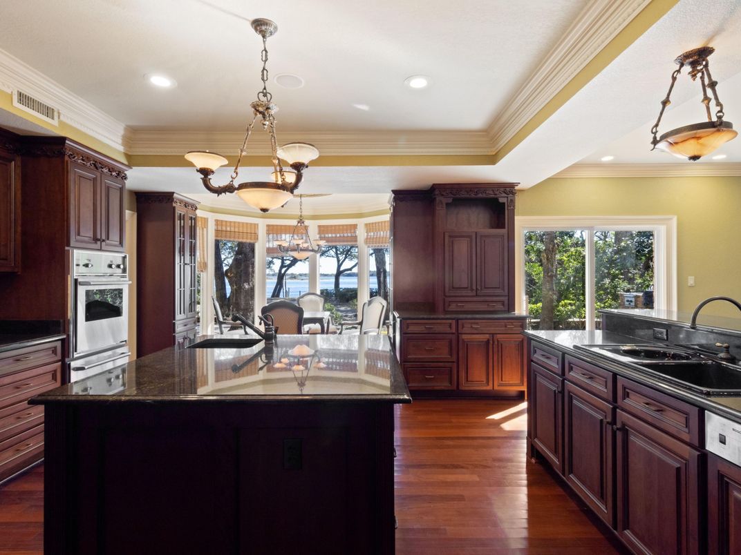 Chandelier, Dining room, Interior, Kitchen, Pendant Lights, Recessed Lighting, Stainless Steel Appliances, Wood Texture Flooring