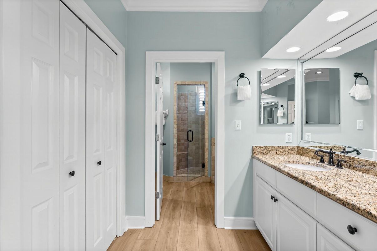 Bathroom, Dual Sink Vanities, Glass Shower, Interior, Recessed Lighting, Wood Texture Flooring