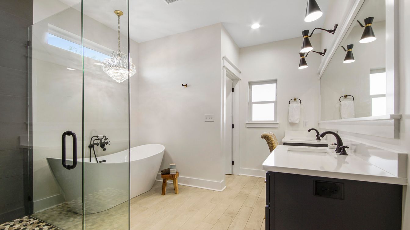 Bathroom, Chandelier, Free Standing Baths, Glass Shower, Interior, Pendant Lights, Recessed Lighting, Wood Texture Flooring