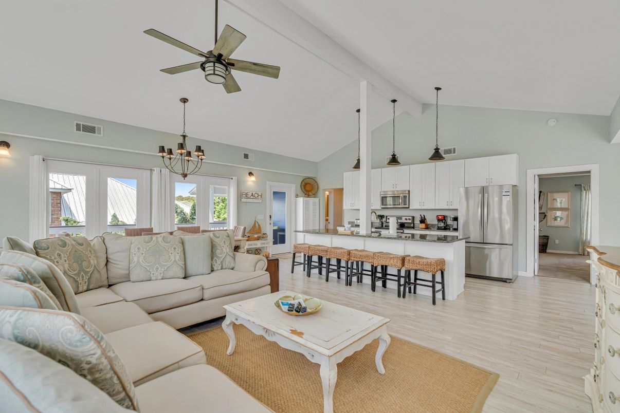 Chandelier, Dining room, Interior, Kitchen, Living room, Pendant Lights, Stainless Steel Appliances, Wood Texture Flooring