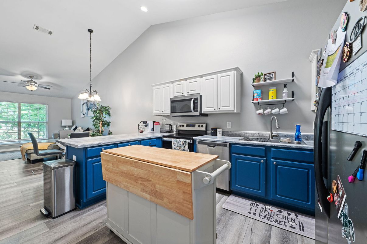 Dining room, Interior, Kitchen, Pendant Lights, Recessed Lighting, Stainless Steel Appliances, Wood Texture Flooring
