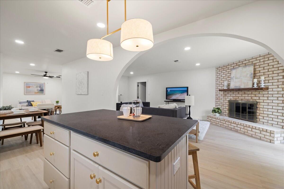 Dining room, Fireplace, Interior, Pendant Lights, Recessed Lighting, Stone Walls, Wood Texture Flooring