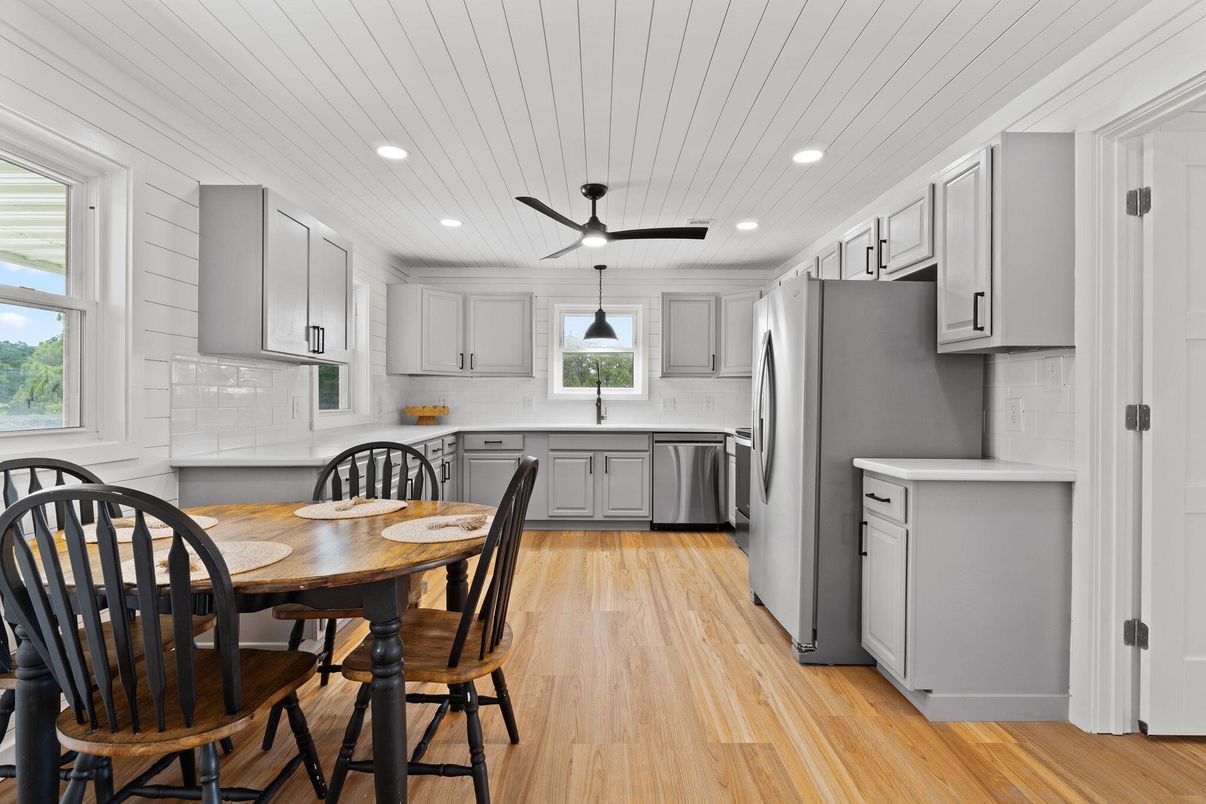 Dining room, Interior, Kitchen, Pendant Lights, Recessed Lighting, Stainless Steel Appliances, Wood Texture Flooring