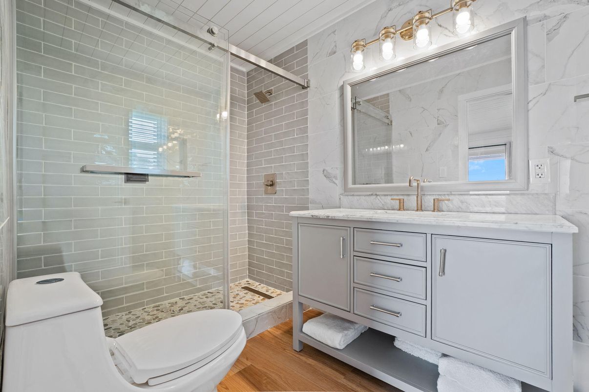 Bathroom, Glass Shower, Interior, Marble Walls, Wood Texture Flooring