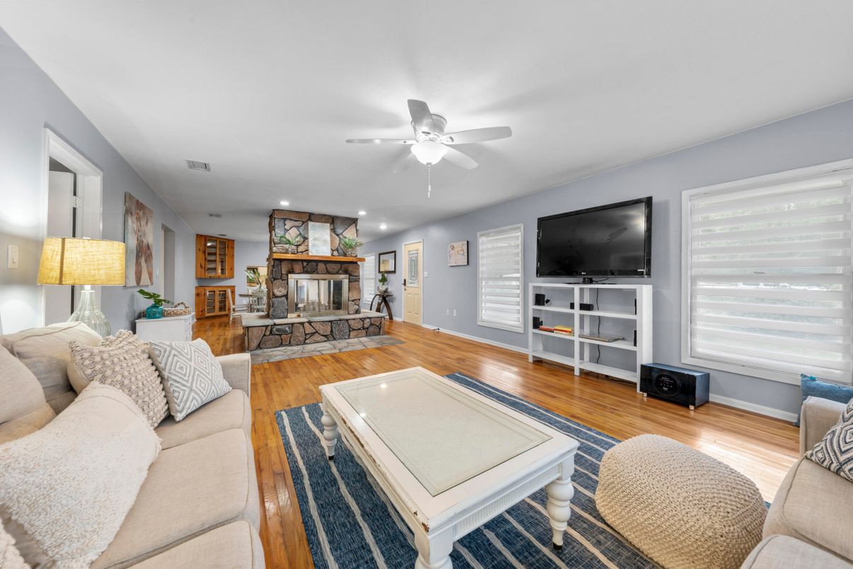 Dining room, Fireplace, Interior, Living room, Recessed Lighting, Wood Texture Flooring