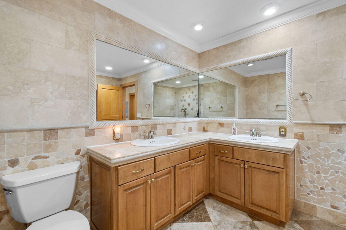 Bathroom, Dual Sink Vanities, Interior, Recessed Lighting, Stone Walls