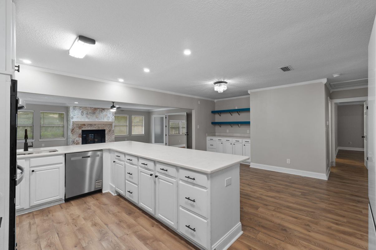 Fireplace, Interior, Kitchen, Recessed Lighting, Stainless Steel Appliances, Wood Texture Flooring