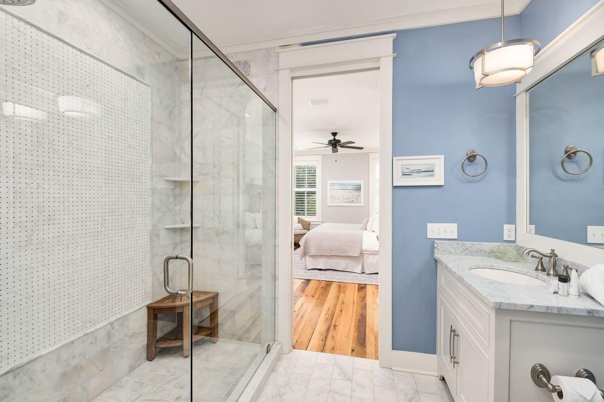 Bathroom, Dual Sink Vanities, Glass Shower, Interior, Marble, Pendant Lights, Wood Texture Flooring
