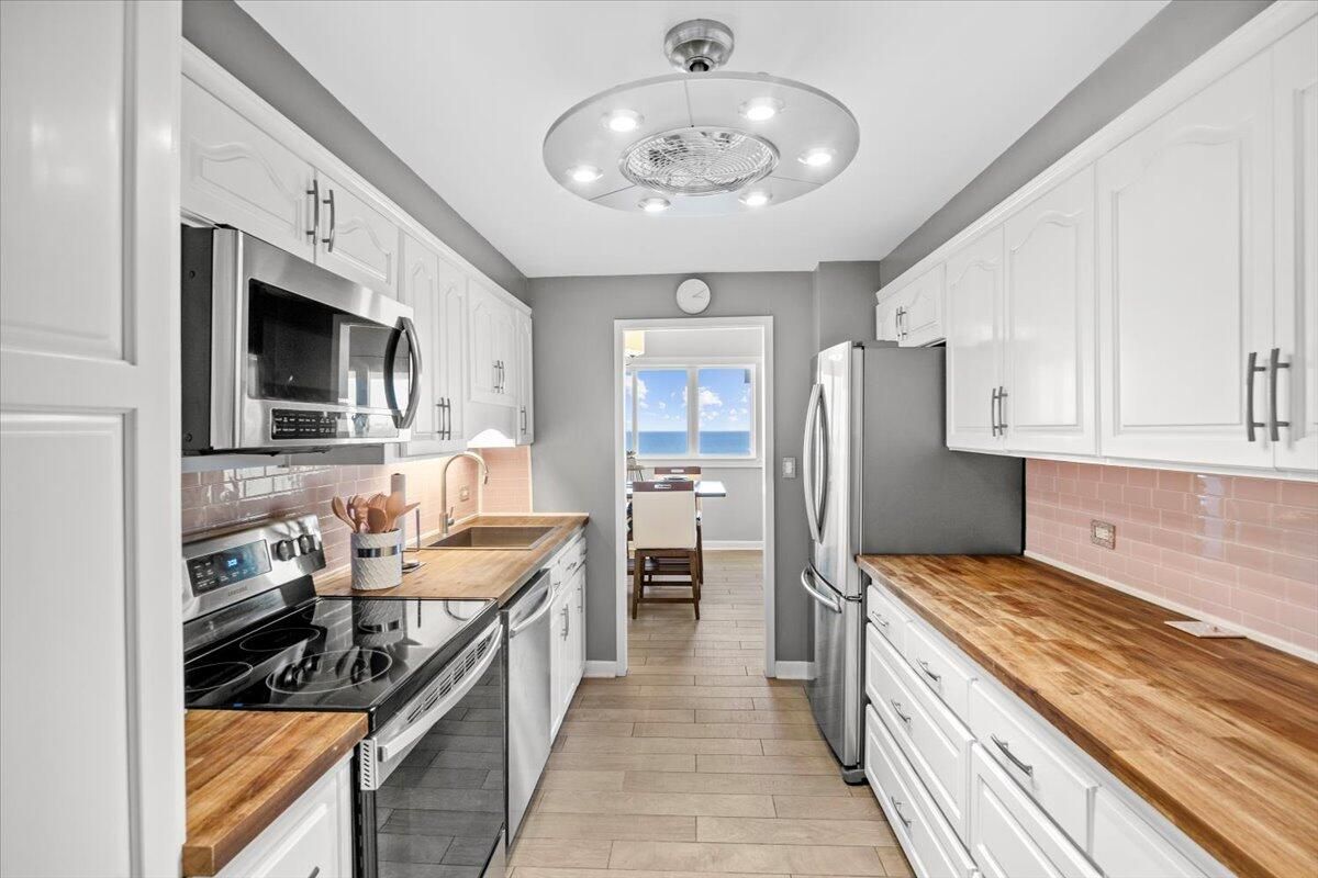 Interior, Kitchen, Recessed Lighting, Stainless Steel Appliances, Water, Wood Texture Flooring