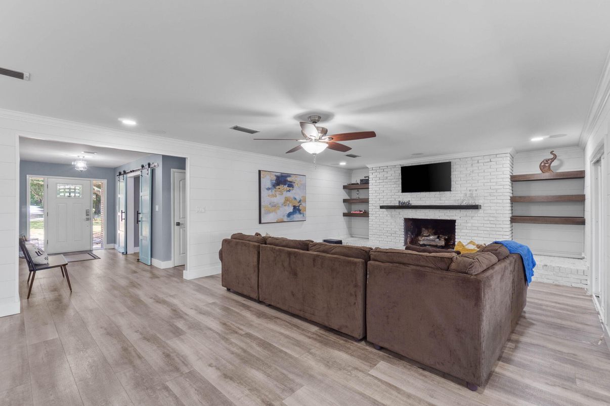 Fireplace, Interior, Living room, Recessed Lighting, Stone Walls, Wood Texture Flooring