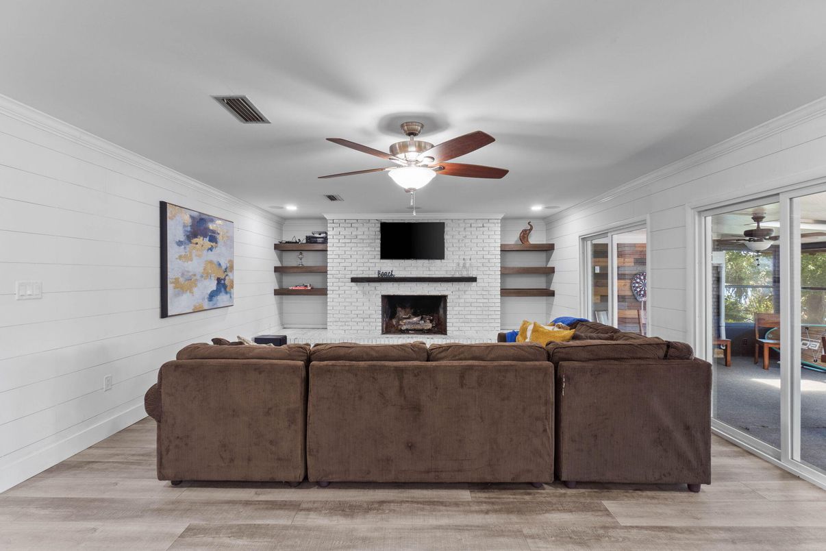 Fireplace, Interior, Living room, Recessed Lighting, Stone Walls, Wood Texture Flooring