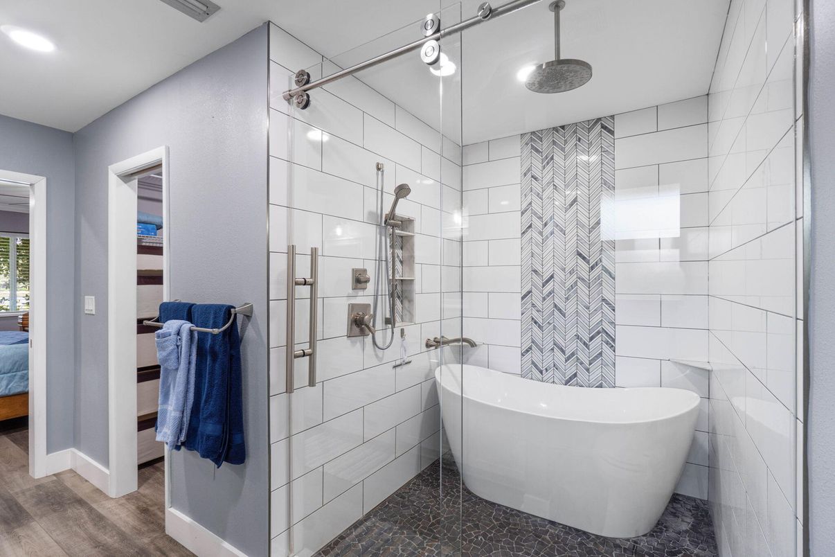 Bathroom, Free Standing Baths, Glass Shower, Interior, Recessed Lighting, Wood Texture Flooring