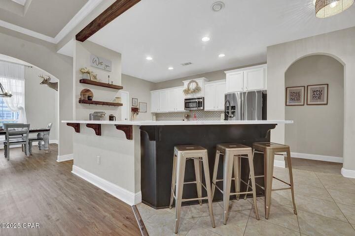 Dining room, Interior, Kitchen, Recessed Lighting, Stainless Steel Appliances, Wood Texture Flooring