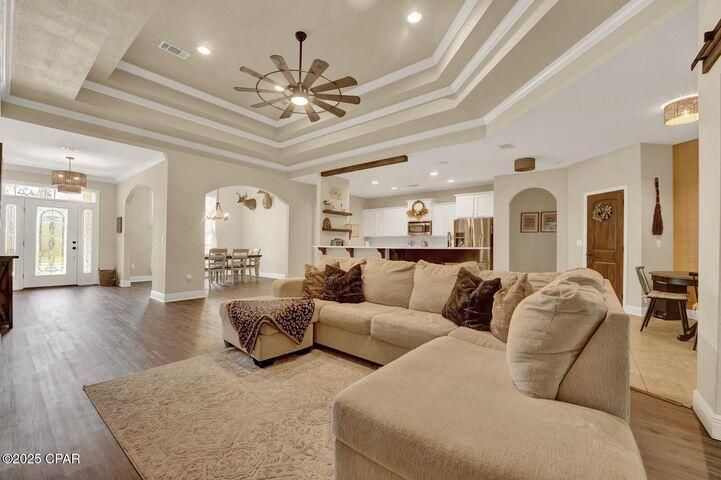 Chandelier, Dining room, Interior, Kitchen, Living room, Pendant Lights, Recessed Lighting, Stainless Steel Appliances, Wood Texture Flooring