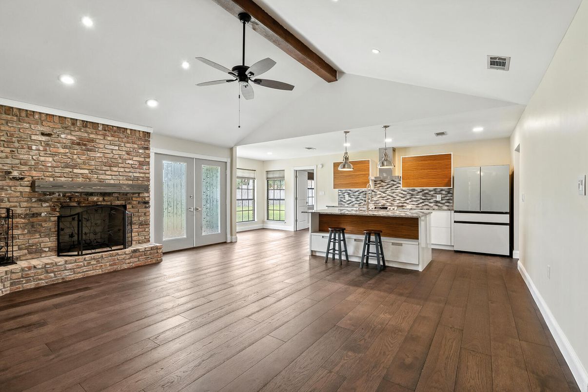 Empty room, Fireplace, Interior, Kitchen, Pendant Lights, Recessed Lighting, Stone Walls, Wooden Beams, Wood Texture Flooring
