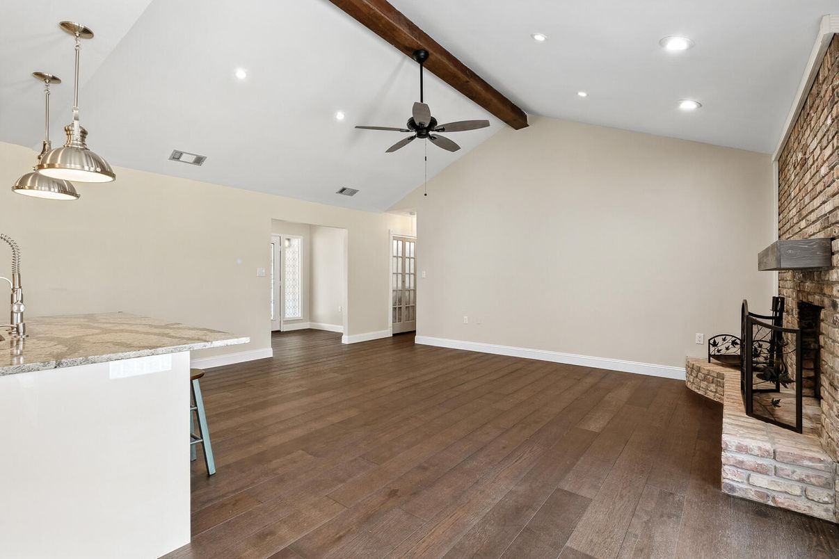Empty room, Fireplace, Interior, Pendant Lights, Recessed Lighting, Wooden Beams, Wood Texture Flooring