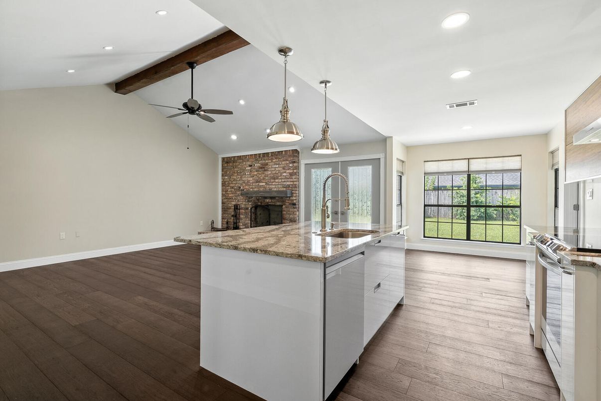 Empty room, Fireplace, Interior, Kitchen, Pendant Lights, Recessed Lighting, Stone Walls, Wooden Beams, Wood Texture Flooring