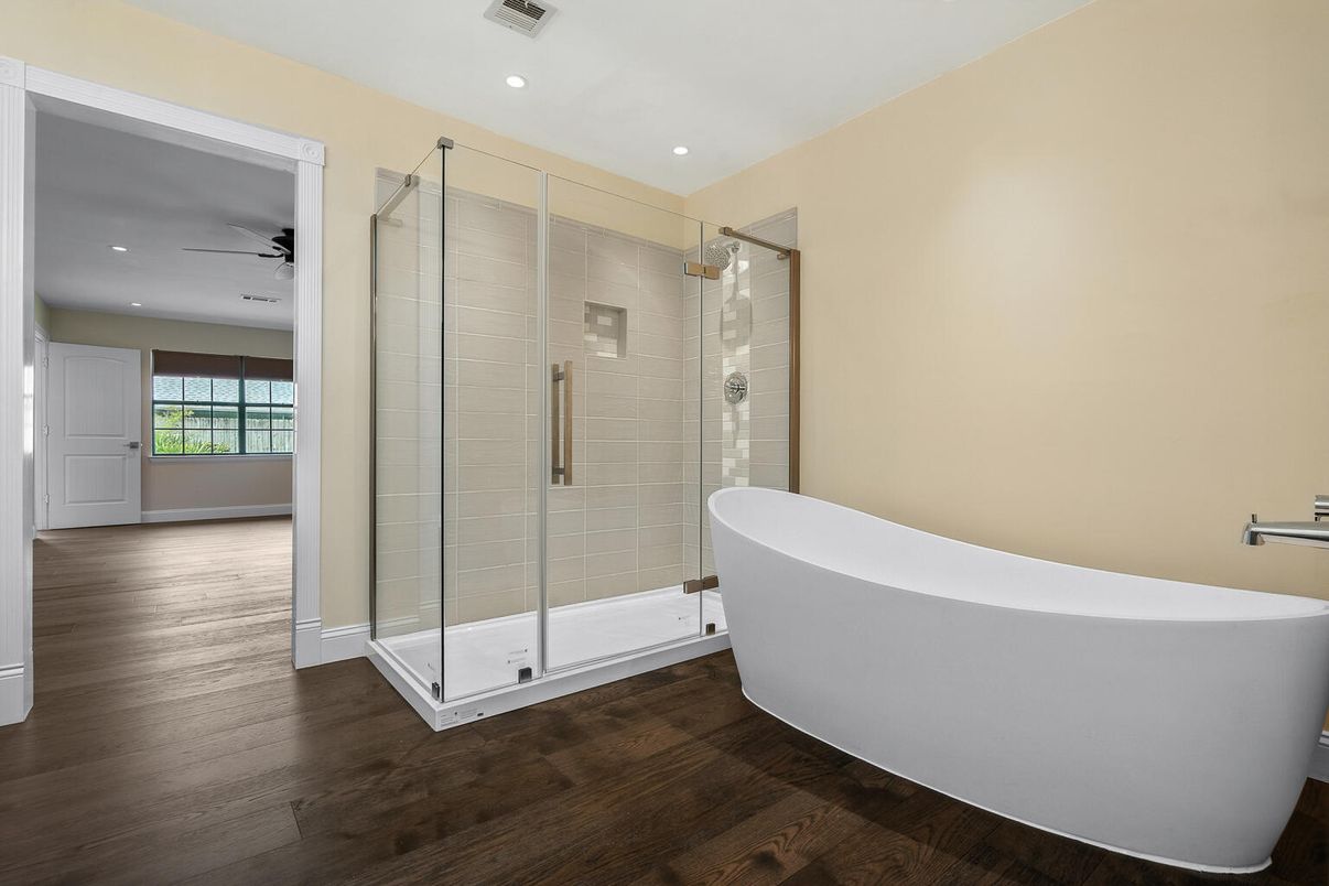Bathroom, Free Standing Baths, Glass Shower, Interior, Recessed Lighting, Wood Texture Flooring