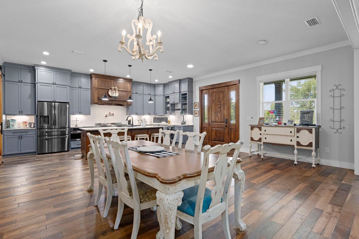 Chandelier, Dining room, Interior, Kitchen, Pendant Lights, Recessed Lighting, Stainless Steel Appliances, Wood Texture Flooring