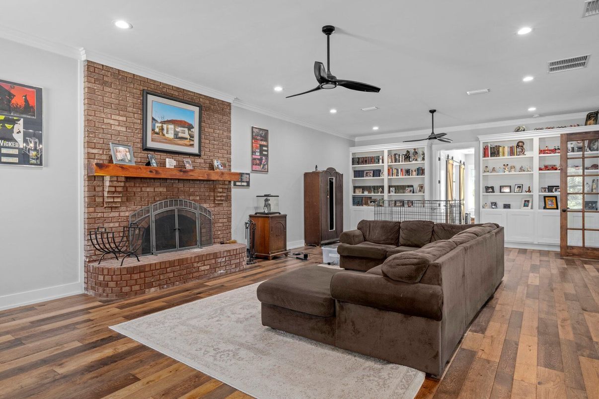 Fireplace, Interior, Living room, Recessed Lighting, Stone Walls, Wood Texture Flooring