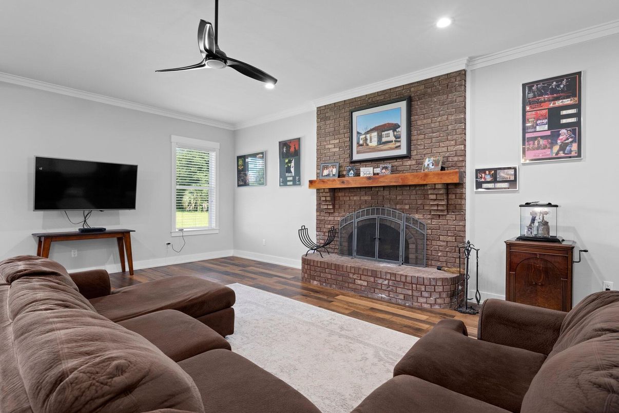 Fireplace, Interior, Living room, Recessed Lighting, Stone Walls, Wood Texture Flooring