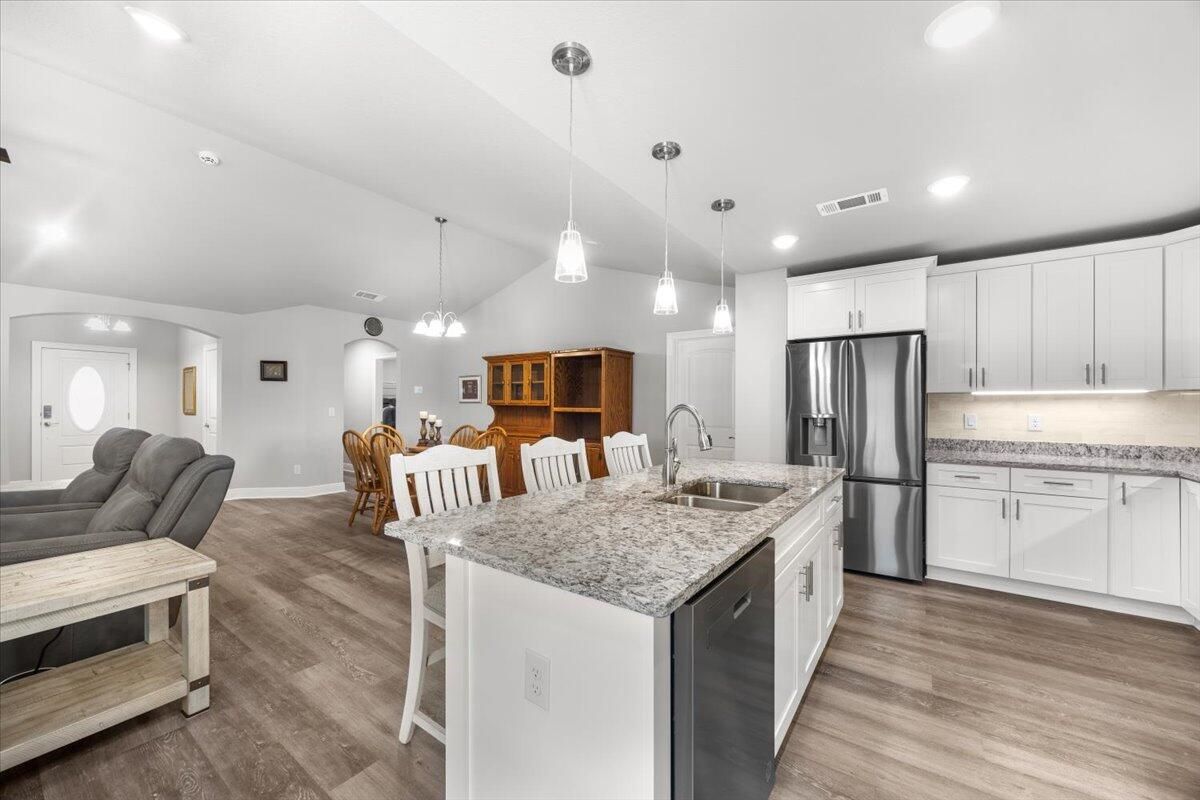 Dining room, Interior, Kitchen, Pendant Lights, Recessed Lighting, Stainless Steel Appliances, Wood Texture Flooring