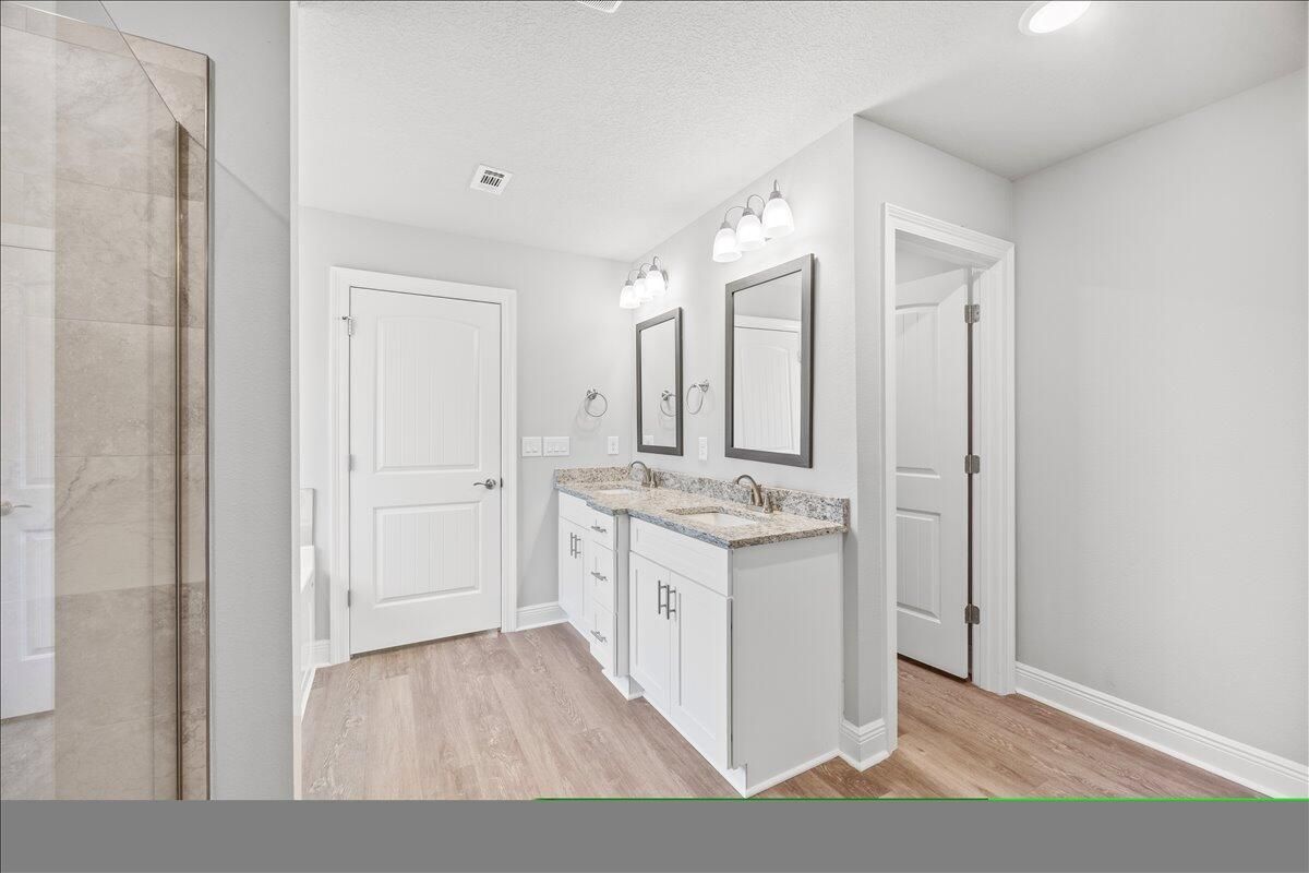 Bathroom, Dual Sink Vanities, Interior, Recessed Lighting, Wood Texture Flooring