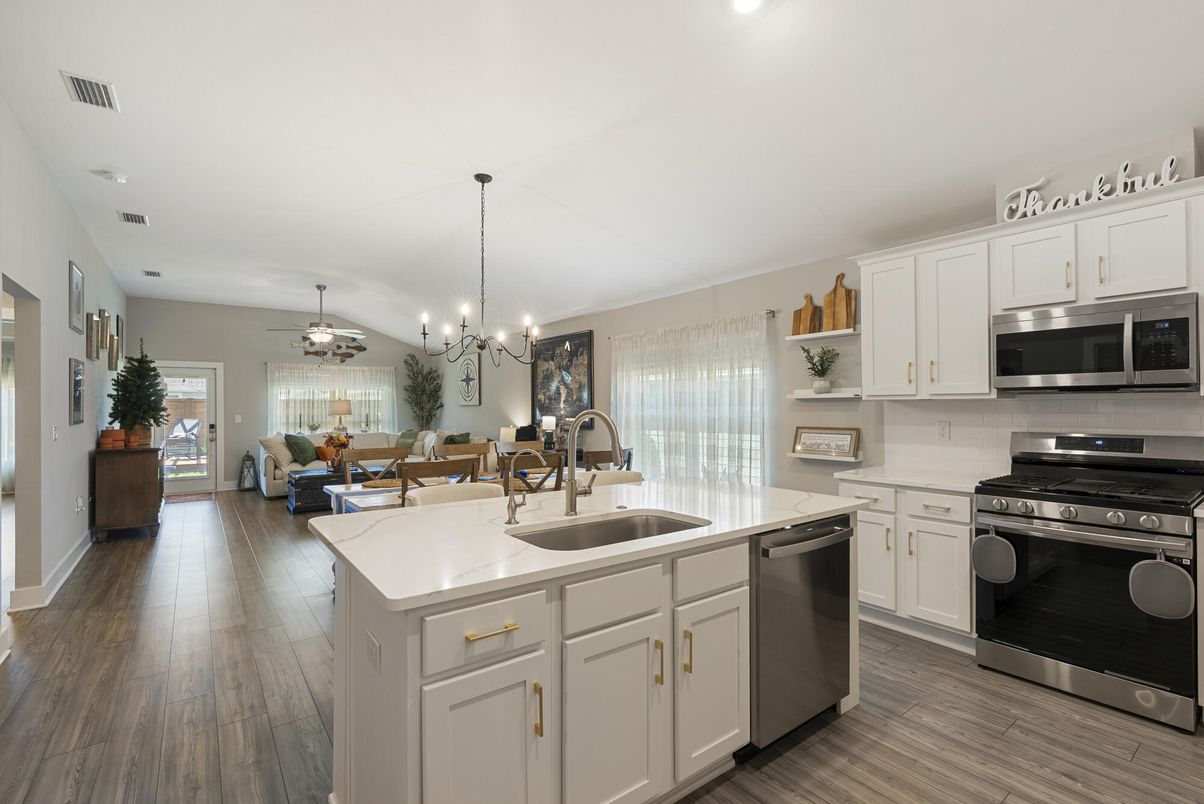 Chandelier, Dining room, Interior, Kitchen, Living room, Pendant Lights, Recessed Lighting, Stainless Steel Appliances, Wood Texture Flooring