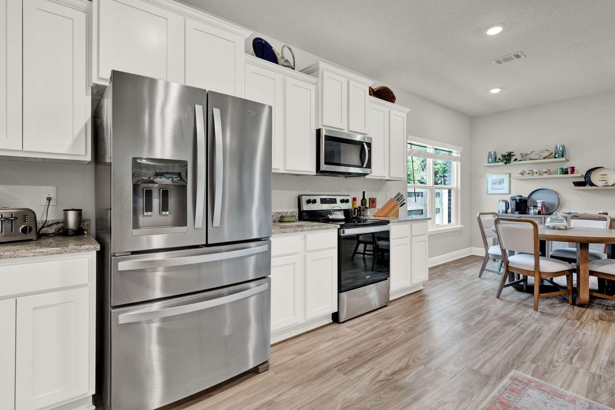Dining room, Interior, Kitchen, Recessed Lighting, Stainless Steel Appliances, Wood Texture Flooring