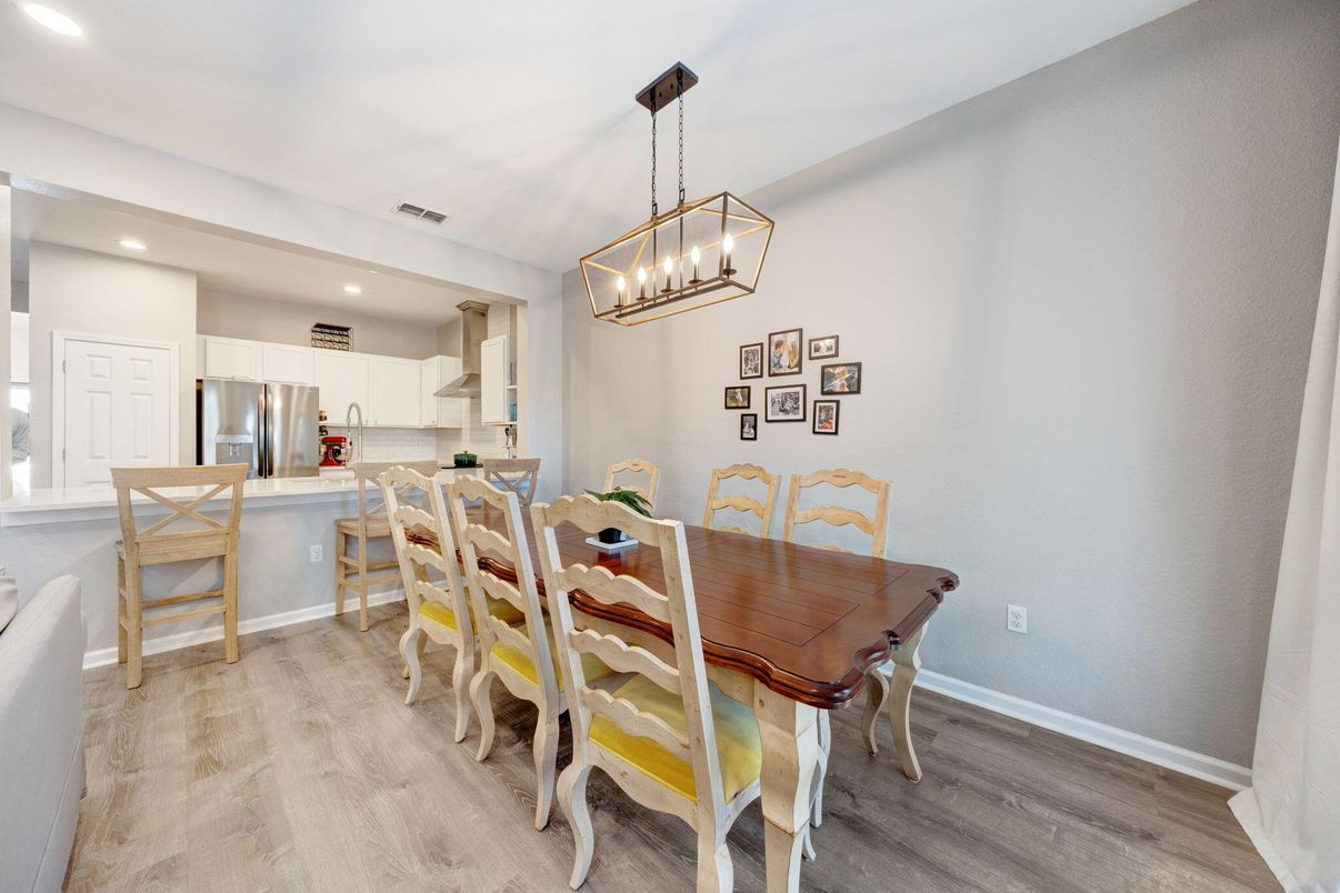 Chandelier, Dining room, Interior, Kitchen, Pendant Lights, Recessed Lighting, Stainless Steel Appliances, Wood Texture Flooring