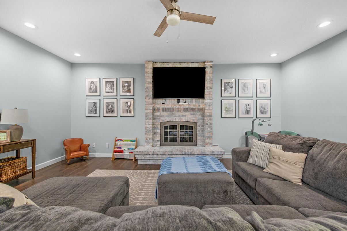 Fireplace, Interior, Living room, Recessed Lighting, Stone Walls, Wood Texture Flooring