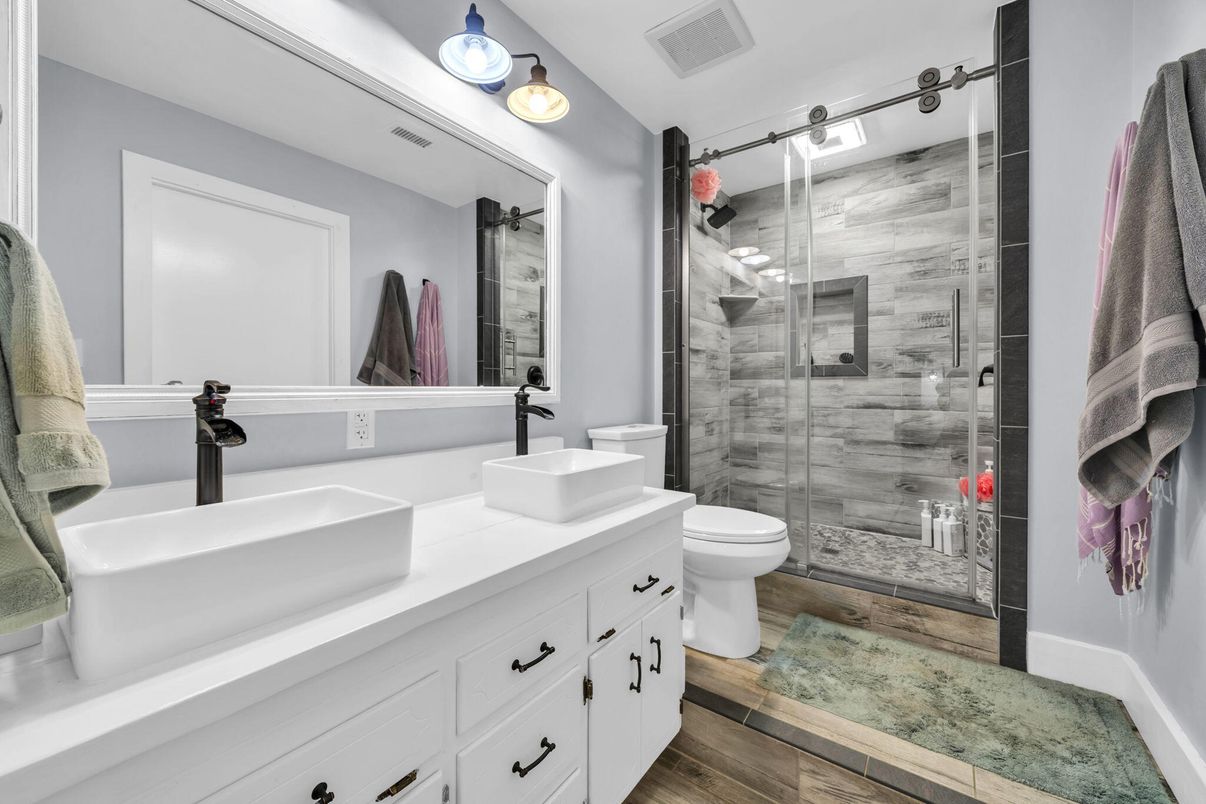 Bathroom, Dual Sink Vanities, Glass Shower, Interior, Wood Texture Flooring