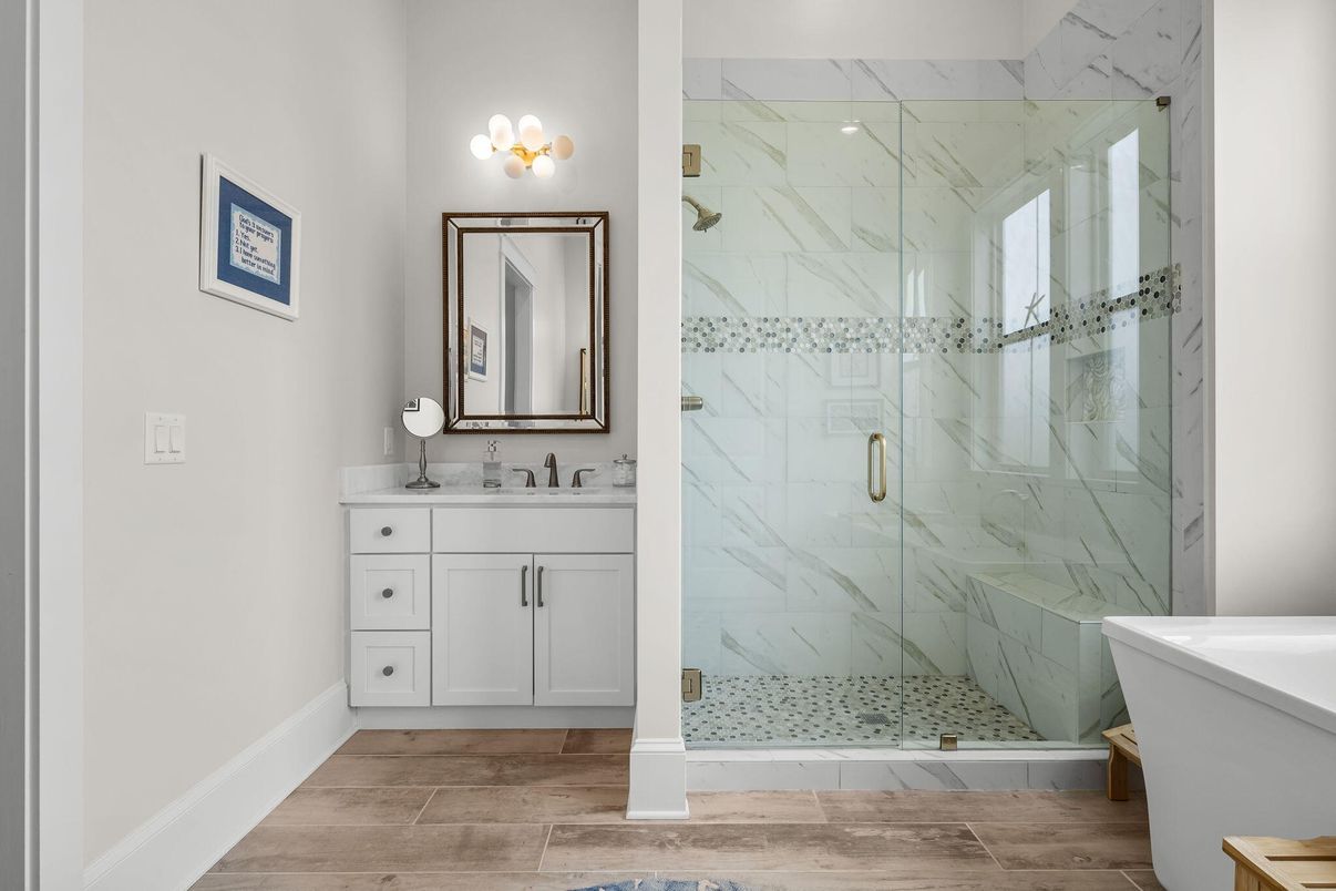 Bathroom, Dual Sink Vanities, Glass Shower, Interior, Marble Walls, Wood Texture Flooring