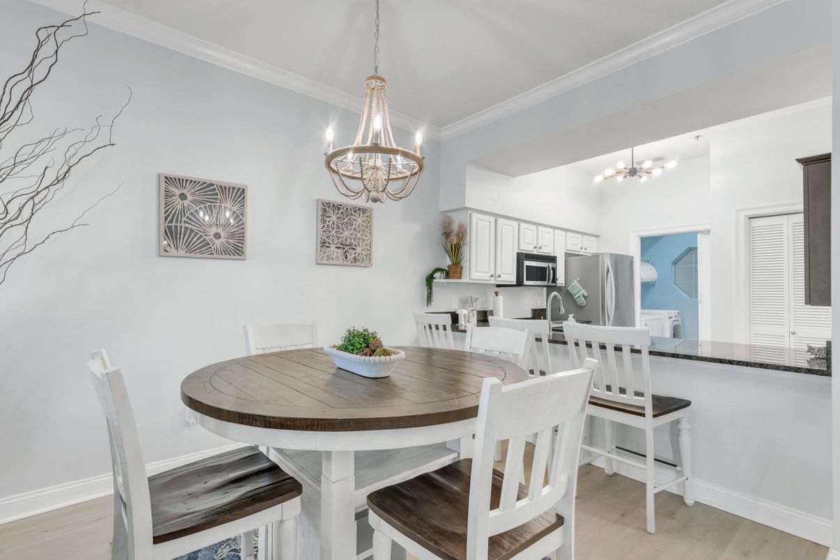 Chandelier, Dining room, Interior, Kitchen, Pendant Lights, Stainless Steel Appliances, Wood Texture Flooring