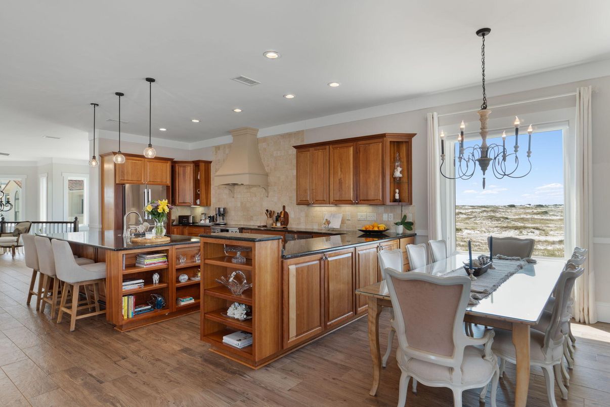 Chandelier, Dining room, Interior, Kitchen, Pendant Lights, Recessed Lighting, Stainless Steel Appliances, Stone Walls, Wood Texture Flooring