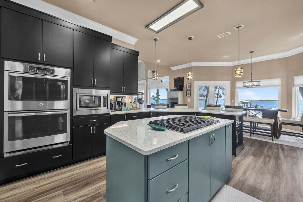 Dining room, Interior, Kitchen, Pendant Lights, Stainless Steel Appliances, Water, Wood Texture Flooring