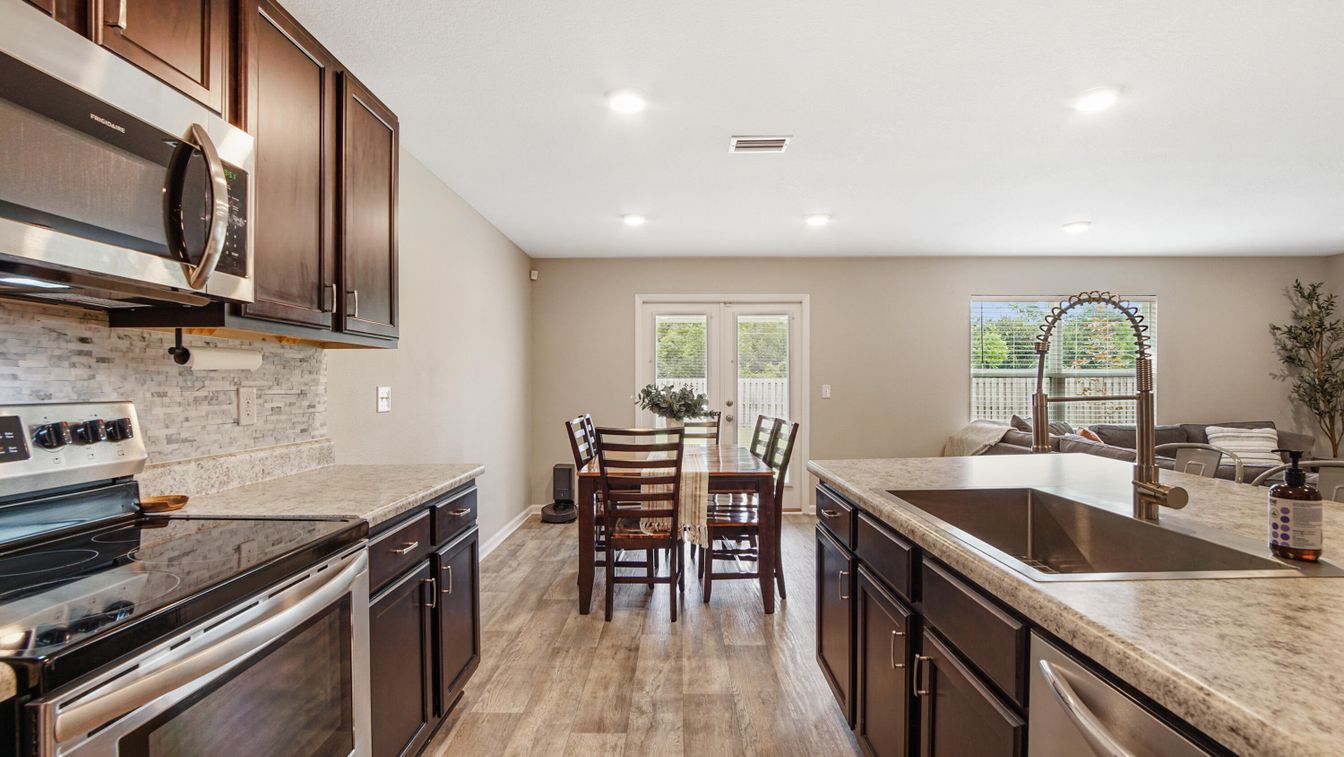 Dining room, Interior, Kitchen, Recessed Lighting, Stainless Steel Appliances, Wood Texture Flooring