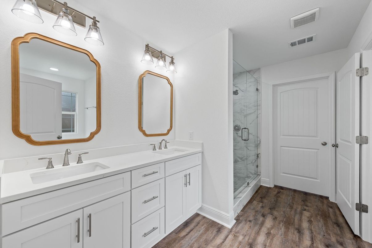 Bathroom, Dual Sink Vanities, Glass Shower, Interior, Marble Walls, Recessed Lighting, Wood Texture Flooring