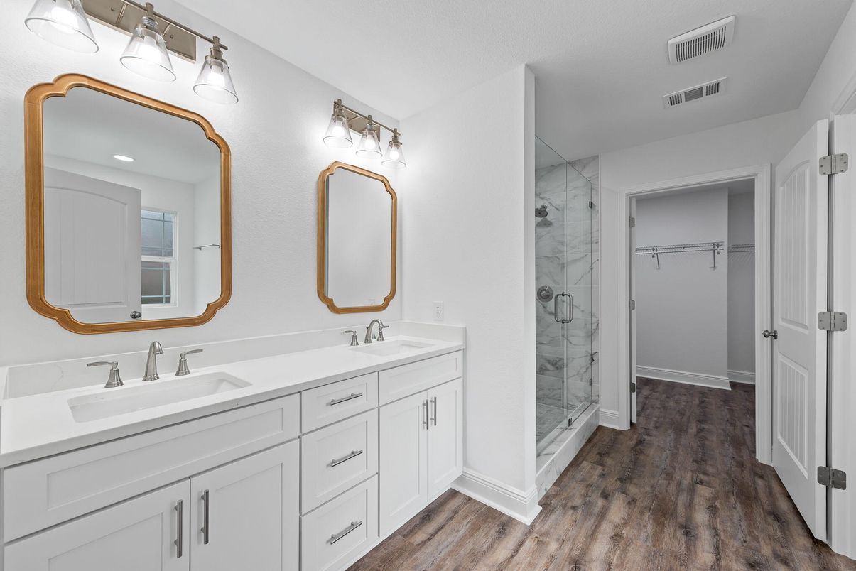 Bathroom, Dual Sink Vanities, Glass Shower, Interior, Marble Walls, Recessed Lighting, Wood Texture Flooring